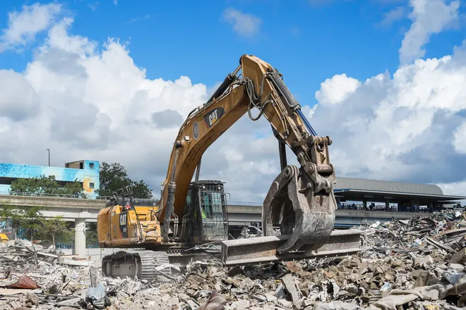 An excavator operator uses a steel girder to move debris from the teardown of the First Baptist Church of Jacksonville’s old sanctuary in downtown Jacksonville, Fla. Wednesday, September 23, 2026.