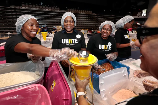 Volunteers work at a meal-packing event in Jacksonville for the Feeding Northeast Florida food bank. The 9/11 nonprofit staged similar events in 50 cities on Sept. 11 to make the anniversary a day of "doing good."