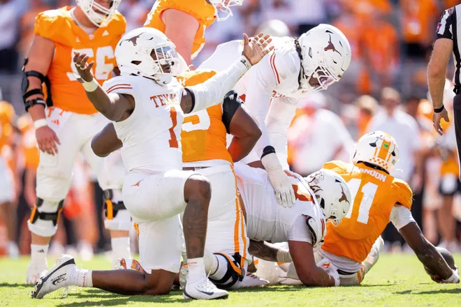 Texas edge Colin Simmons (1) celebrates after Tennessee quarterback Faizon Brandon (11) is sacked again during a college football game between Tennessee and Texas at Neyland Stadium in Knoxville, Tenn. on Sept. 26, 2026.