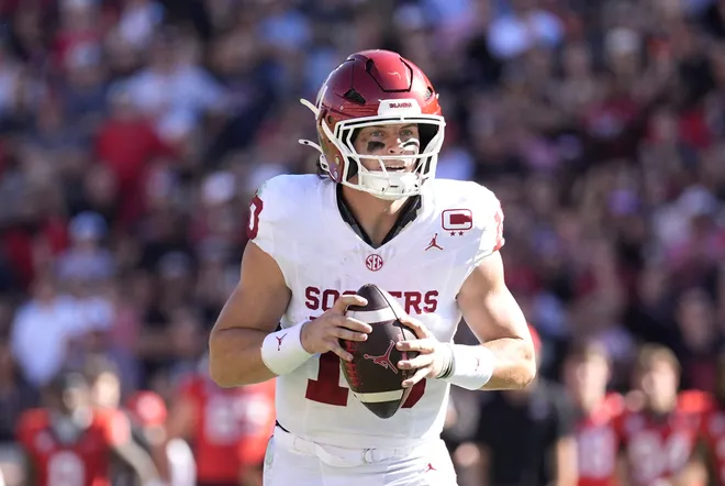 Sep 26, 2026; Athens, Georgia, USA; Oklahoma Sooners quarterback John Mateer (10) looks to throw a pass against the Georgia Bulldogs during the first half at Sanford Stadium. Mandatory Credit: Dale Zanine-Imagn Images