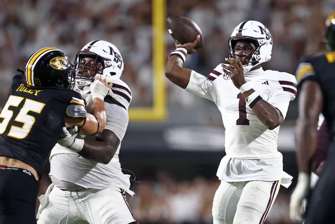 Sep 26, 2026; Starkville, Mississippi, USA; Mississippi State Bulldogs quarterback Kamario Taylor (1) passes the ball for a touchdown during the fourth quarter against the Missouri Tigers at Davis Wade Stadium at Scott Field. Mandatory Credit: Petre Thomas-Imagn Images