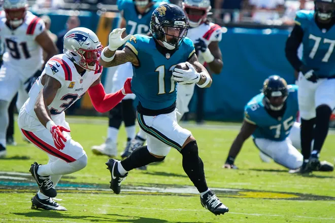 Jacksonville Jaguars wide receiver Parker Washington (11) eludes New England Patriots safety Kevin Byard (31) in the first quarter during an NFL football game at EverBank Stadium, Sunday, September 27, 2026, in Jacksonville, Fla. [Doug Engle/Florida Times-Union]