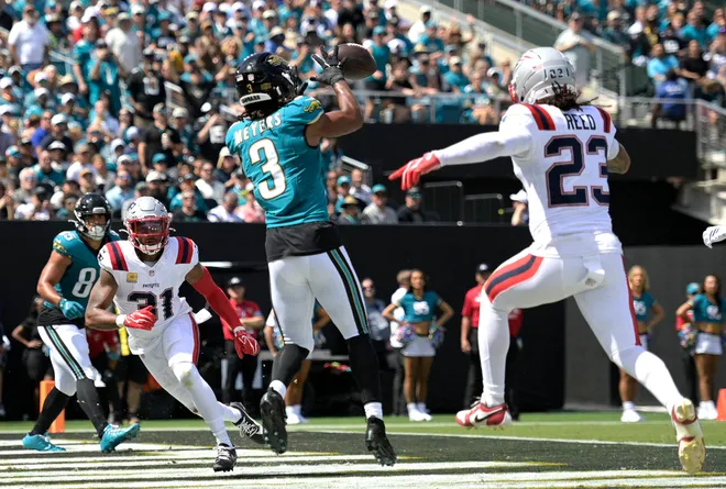 Sep 27, 2026; Jacksonville, Florida, USA; Jacksonville Jaguars wide receiver Jakobi Meyers (3) catches a pass for a touchdown past New England Patriots safety Jaylen Reed (23) during the second quarter against the New England Patriots at EverBank Stadium. Mandatory Credit: Melina Myers-Imagn Images