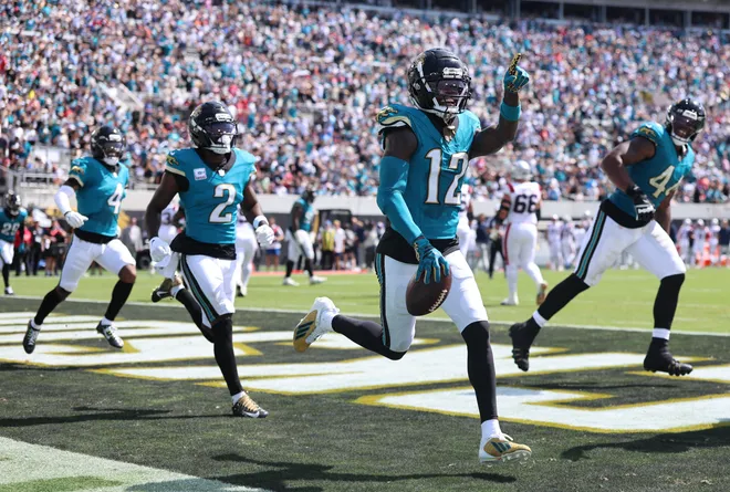 Sep 27, 2026; Jacksonville, Florida, USA; Jacksonville Jaguars wide receiver Travis Hunter (12) celebrates after an interception during the second quarter against the New England Patriots at EverBank Stadium. Mandatory Credit: Morgan Tencza-Imagn Images