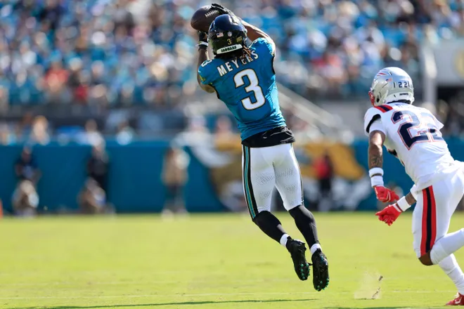 Jacksonville Jaguars wide receiver Jakobi Meyers (3) hauls in a reception against New England Patriots cornerback Charles Woods (22) during the fourth quarter of an NFL football matchup at EverBank Stadium on Sunday, Sept. 27, 2026, in Jacksonville, Fla. The Jaguars defeated the Patriots 35-6. [Corey Perrine/Florida Times-Union]