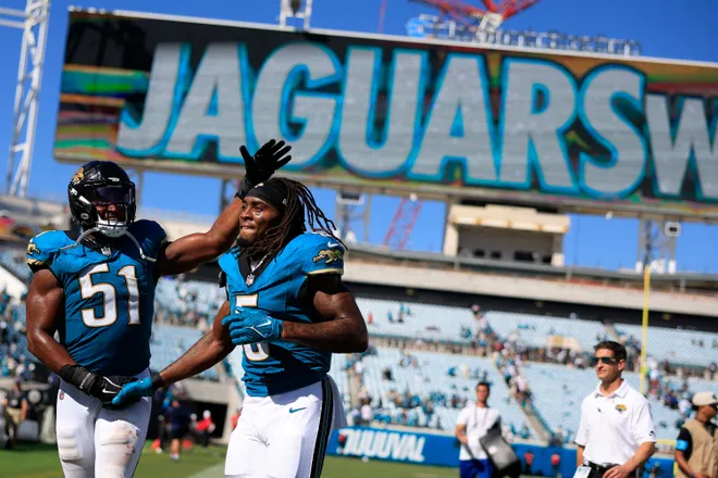 Jacksonville Jaguars linebacker Ventrell Miller (51) and running back LeQuint Allen Jr. (5) walk off the field after the game of an NFL football matchup at EverBank Stadium on Sunday, Sept. 27, 2026, in Jacksonville, Fla. The Jaguars defeated the Patriots 35-6. [Corey Perrine/Florida Times-Union]