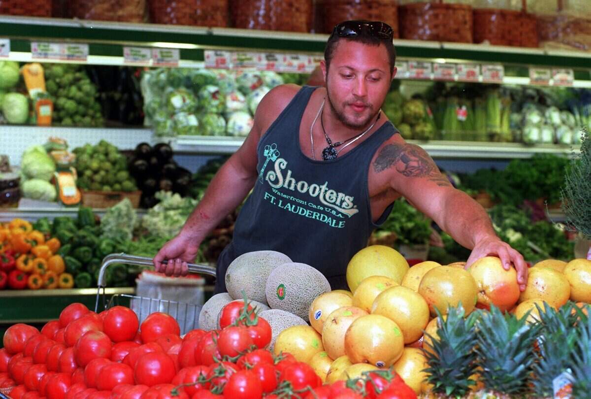 In 1995, a customer shops the Epicure produce section.