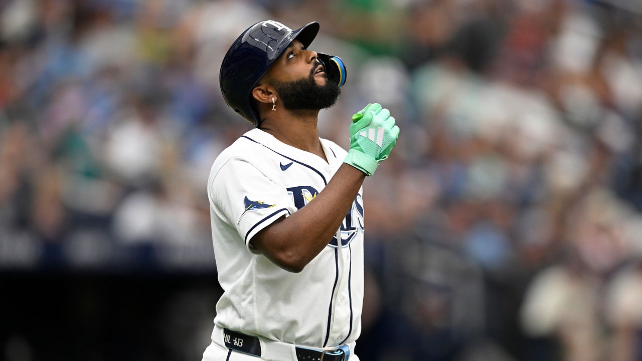 Tampa Bay Rays' Junior Caminero reacts while walking to first base during the sixth inning of a baseball game against the Seattle Mariners, Sunday, July 12, 2026, in St. Petersburg, Fla. (AP Photo/Phelan M. Ebenhack)