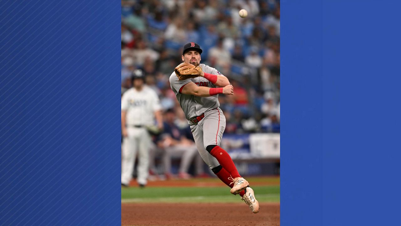 Boston Red Sox third baseman Caleb Durbin throws out Tampa Bay Rays' Yandy Díaz at first base after fielding Diaz's ground ball during the seventh inning of a baseball game, Sunday, Sept. 20, 2026, in St. Petersburg, Fla. (AP Photo/Phelan M. Ebenhack)