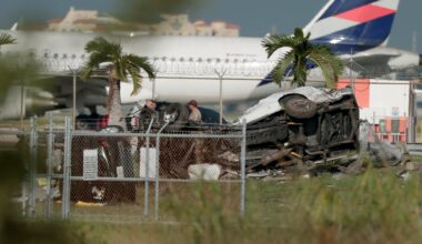 Investigators walk near damaged vehicles at Miami International Airport on Sept. 6, 2026 in Miami, Florida. The vehicles were damaged when an Amazon cargo plane crashed, with five people confirmed killed during the crash. According to the Federal Aviation Administration, Prime Air Flight 7598 overran the runway while landing around 2 p.m. after departing from Luis Muñoz Marín International Airport in San Juan, Puerto Rico.