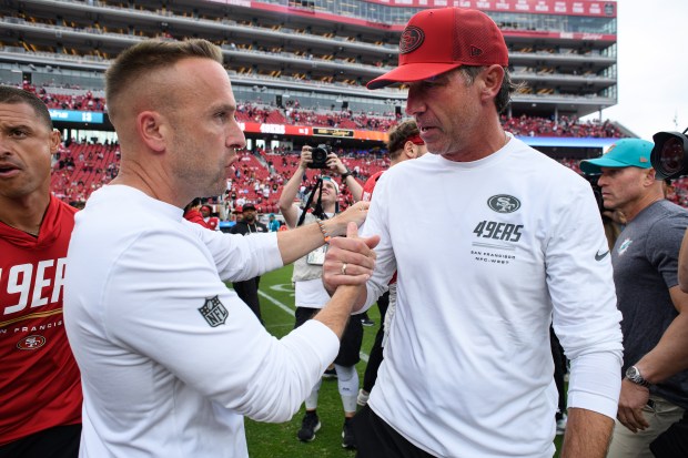 Miami Dolphins head coach Jeff Hafley congratulates San Francisco 49ers head coach Kyle Shanahan after their NFL game at Levi's Stadium in Santa Clara, Calif., on Sunday, Sept. 20, 2026. The San Francisco 49ers defeated the Miami Dolphins 35-13. (Jose Carlos Fajardo/Bay Area News Group)
