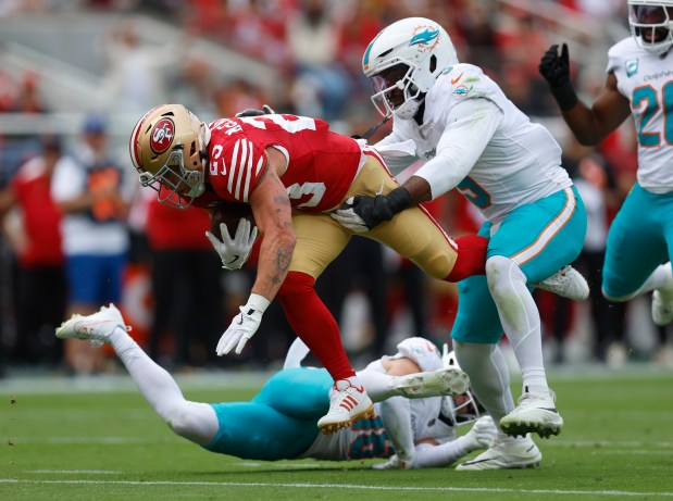 San Francisco 49ers' Christian McCaffrey (23) is stopped short of the end zone against Miami Dolphins' Joshua Uche (9) in the first quarter at Levi's Stadium in Santa Clara, Calif., on Sunday, Sept. 20, 2026. (Nhat V. Meyer/Bay Area News Group)