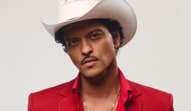 photo of Bruno Mars in a red suit and white cowboy hat