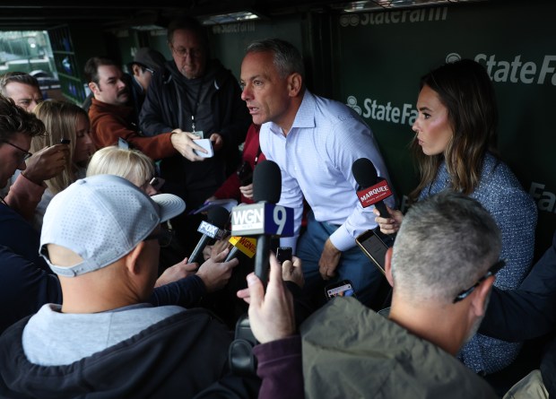 Cubs president of baseball operations Jed Hoyer takes a seat in the dugout to answer reporters' questions before a game against the Marlins at Wrigley Field on Sept. 22, 2026, in Chicago. (John J. Kim/Chicago Tribune)