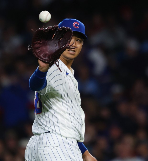 Cubs starting pitcher Shota Imanaga retrieves a ball between batters in the third inning against the Marlins at Wrigley Field on Sept. 22, 2026, in Chicago. (John J. Kim/Chicago Tribune)