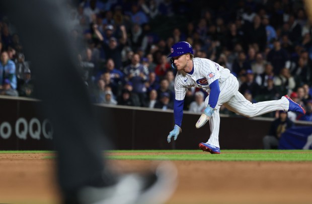 Cubs center fielder Pete Crow-Armstrong begins the dive to steal second base in the third inning against the Marlins at Wrigley Field on Sept. 22, 2026, in Chicago. It was his 39th steal of the season. (John J. Kim/Chicago Tribune)
