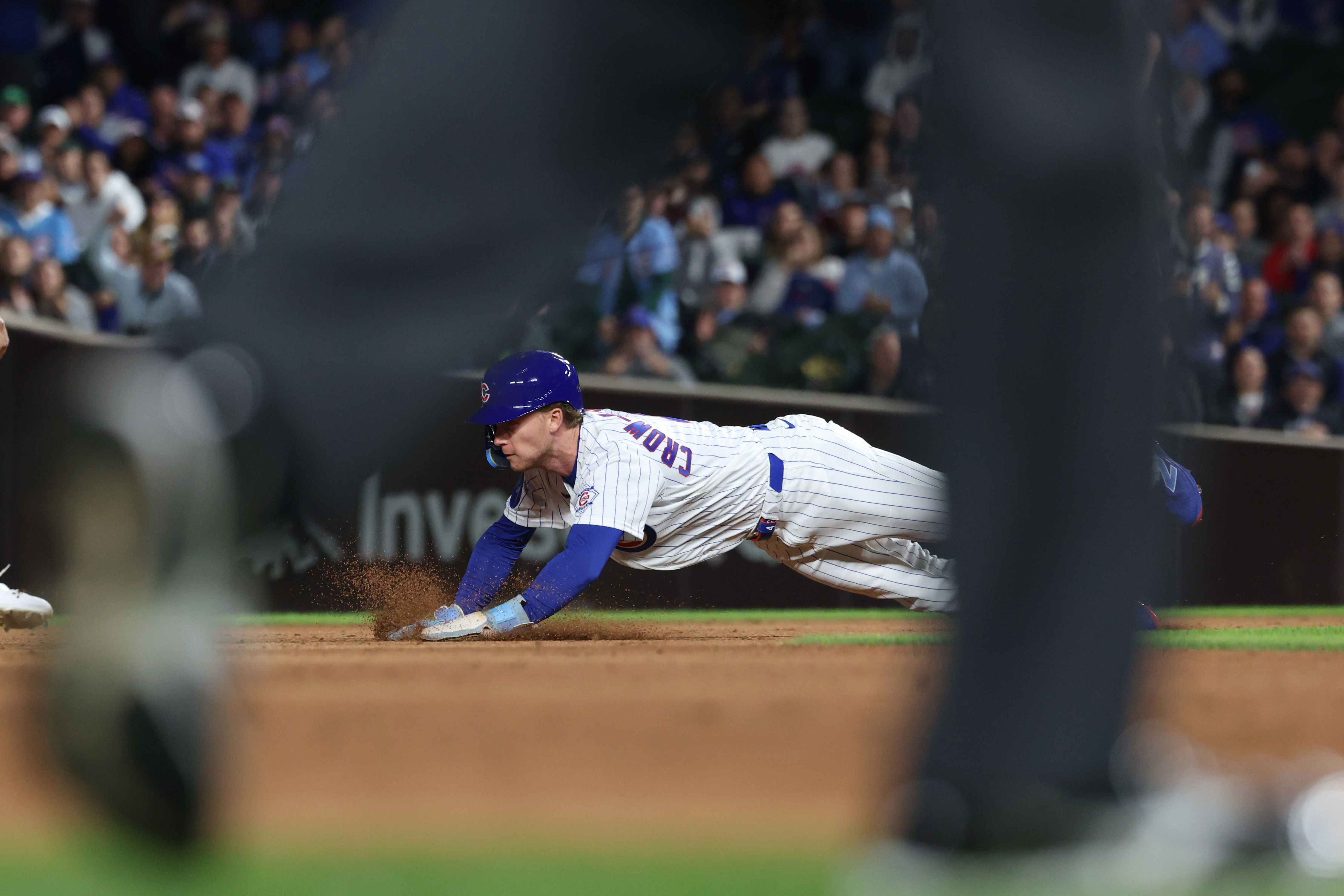 Cubs center fielder Pete Crow-Armstrong dives to steal second base in the third inning against the Marlins at Wrigley Field on Sept. 22, 2026, in Chicago. It was his 39th steal of the season. (John J. Kim/Chicago Tribune)
