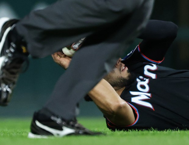 Marlins second baseman Jared Serna fields a ball hit for a single from Cubs catcher Carson Kelly in the fifth inning at Wrigley Field on Sept. 22, 2026, in Chicago. (John J. Kim/Chicago Tribune)