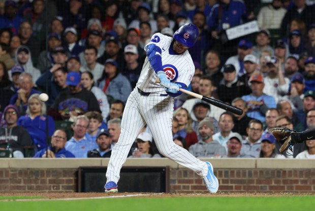 Cubs left fielder Ian Happ swings for an RBI single in the sixth inning against the Marlins at Wrigley Field on Sept. 22, 2026, in Chicago. (John J. Kim/Chicago Tribune)