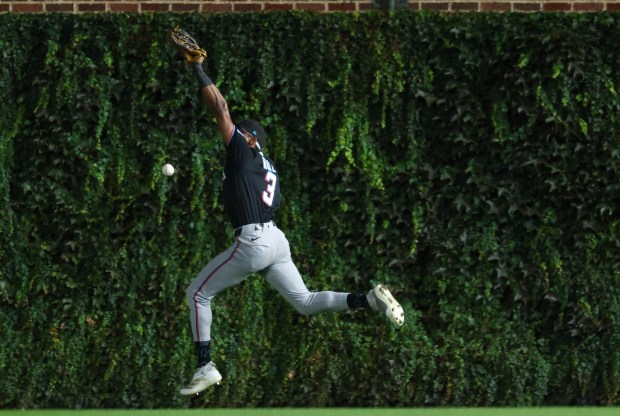 Marlins right fielder Esteury Ruiz is unable to catch a ball hit  by Cubs right fielder Seiya Suzuki for a double in the seventh inning at Wrigley Field on Sept. 22, 2026, in Chicago. (John J. Kim/Chicago Tribune)