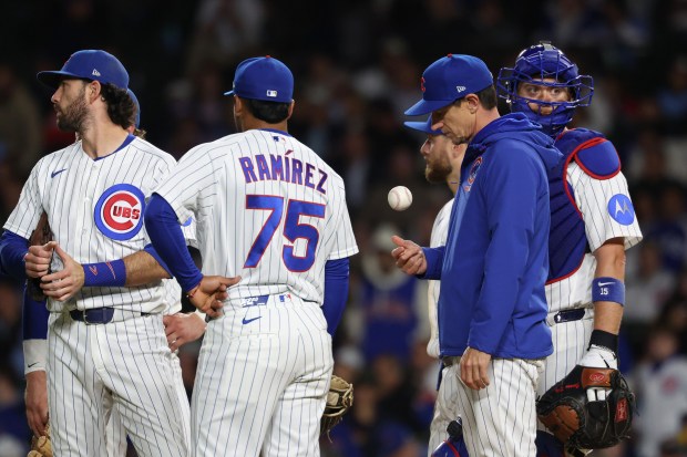 Cubs manager Craig Counsell tosses the ball in the air during a pitching change in the eighth inning against the Marlins at Wrigley Field on Sept. 22, 2026, in Chicago. (John J. Kim/Chicago Tribune)