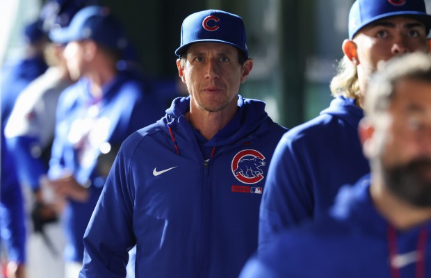 Cubs manager Craig Counsell, center, exits the dugout after an 8-2 loss to the Marlins in 12 innings at Wrigley Field on Sept. 22, 2026, in Chicago. (John J. Kim/Chicago Tribune)