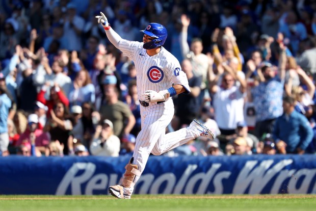 Cubs right fielder Seiya Suzuki celebrates as he rounds the bases after hitting a solo home run in the fifth inning against the Marlins on Thursday, Sept. 24, 2026, at Wrigley Field. (Chris Sweda/Chicago Tribune)