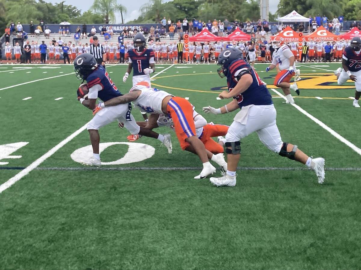 Columbus running back Cecil Smith takes off on a 47-yard catch-and-run touchdown that gave the Explorers a 7-0 first quarter lead during Saturday’s game against Las Vegas Bishop Gorman at St. Thomas Aquinas High School in Fort Lauderdale, Fla.