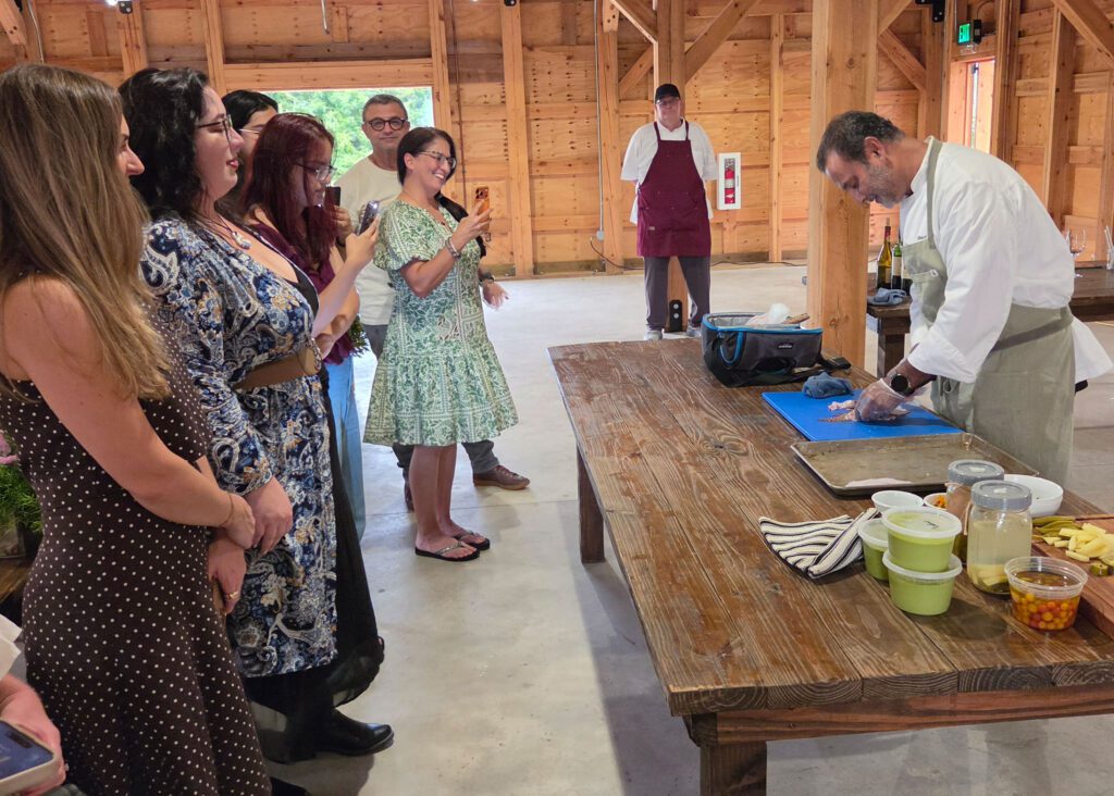 chef preparing food in front of a group of people