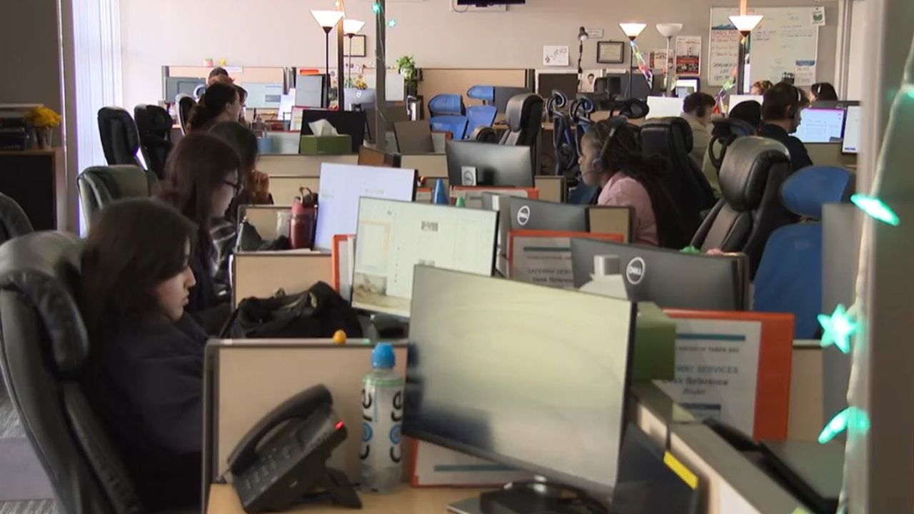 Dozens of crisis coordinators work phones inside the Crisis Center of Tampa Bay call center