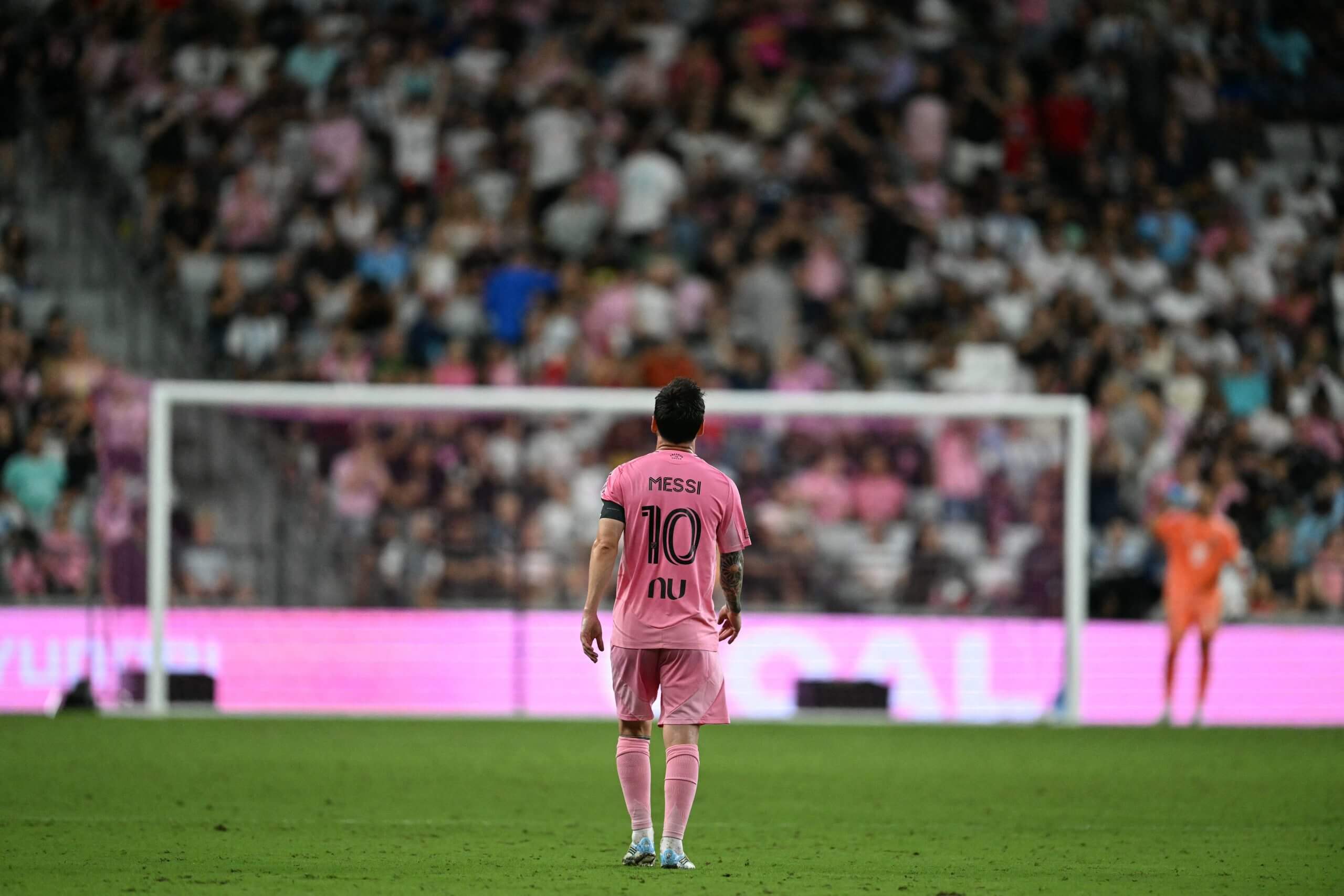 Lionel Messi walks on the field at Nu Stadium
