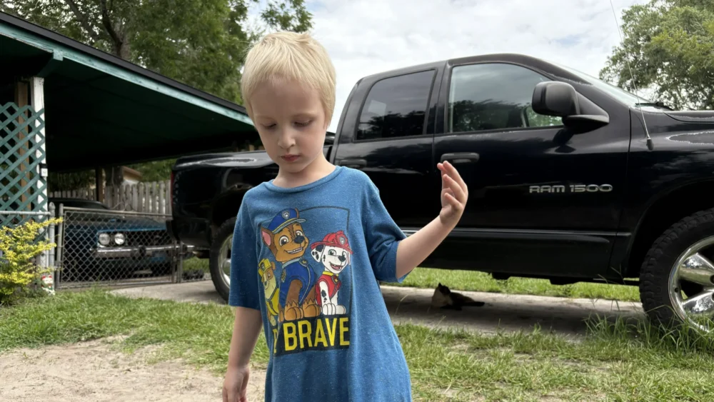 Dog bite victim Roland Moore in his driveway