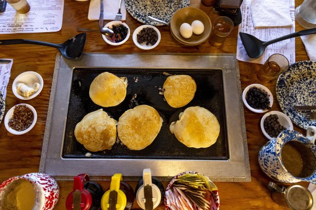 Pancakes are prepared by diners on tabletop griddles at the Old Spanish Sugar Mill restaurant in De Leon Springs State Park. This season, they've got pumpkin spice!