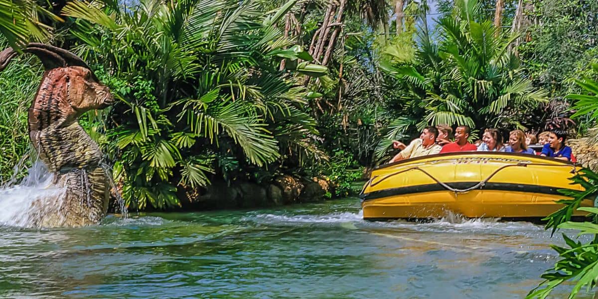 Guests ride Jurassic Park River Adventure