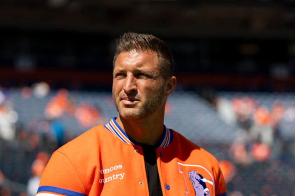 Tim Tebow looks on prior to an NFL football game against the Jacksonville Jaguars, Sunday,...
