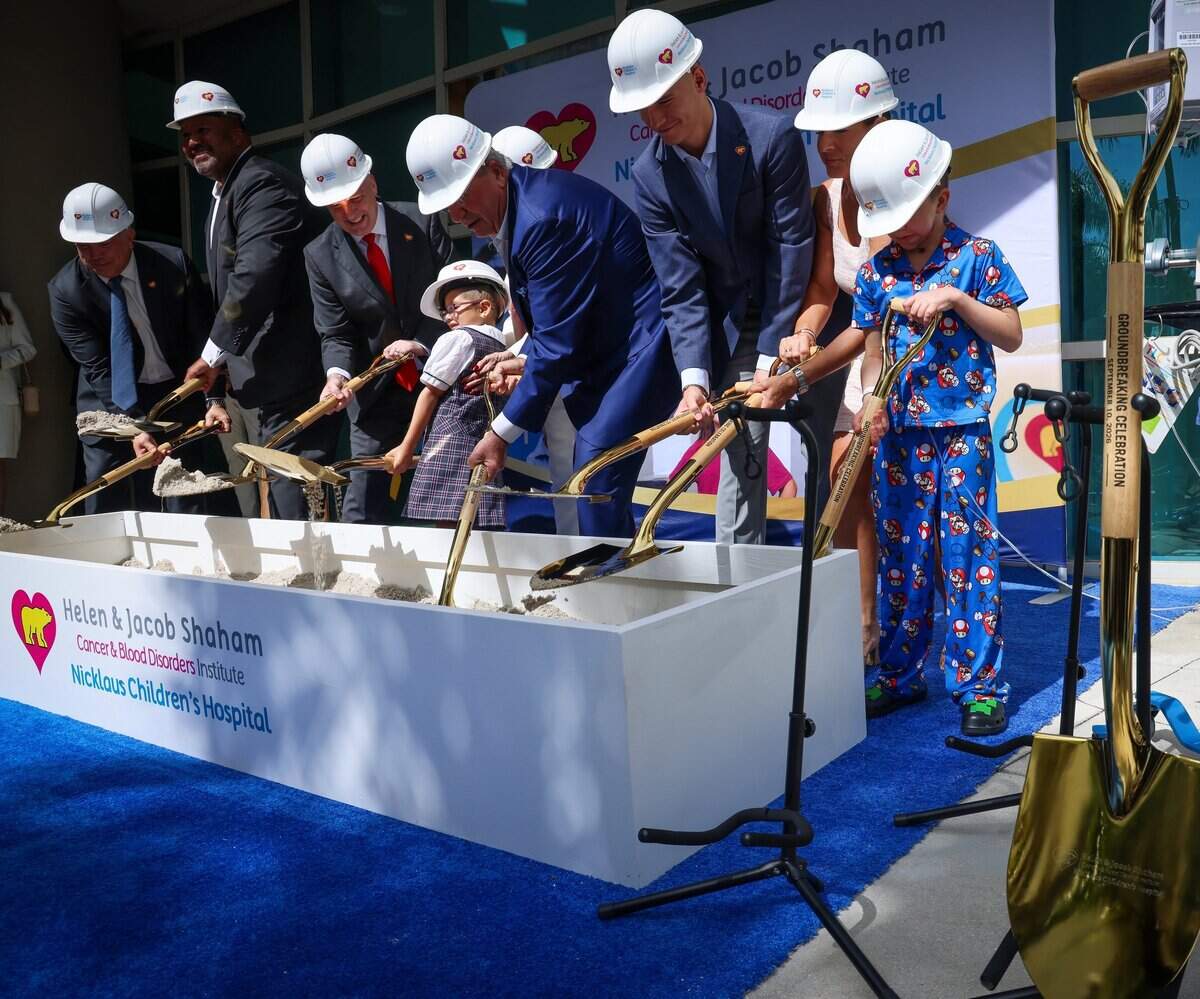 Abbey Rose, 6, center, lifts her shovel among others as Nicklaus Children's Hospital hosted a groundbreaking ceremony Thursday, Sept. 10, 2026, for the future Helen & Jacob Shaham Cancer & Blood Disorders Institute in Miami, Fla.