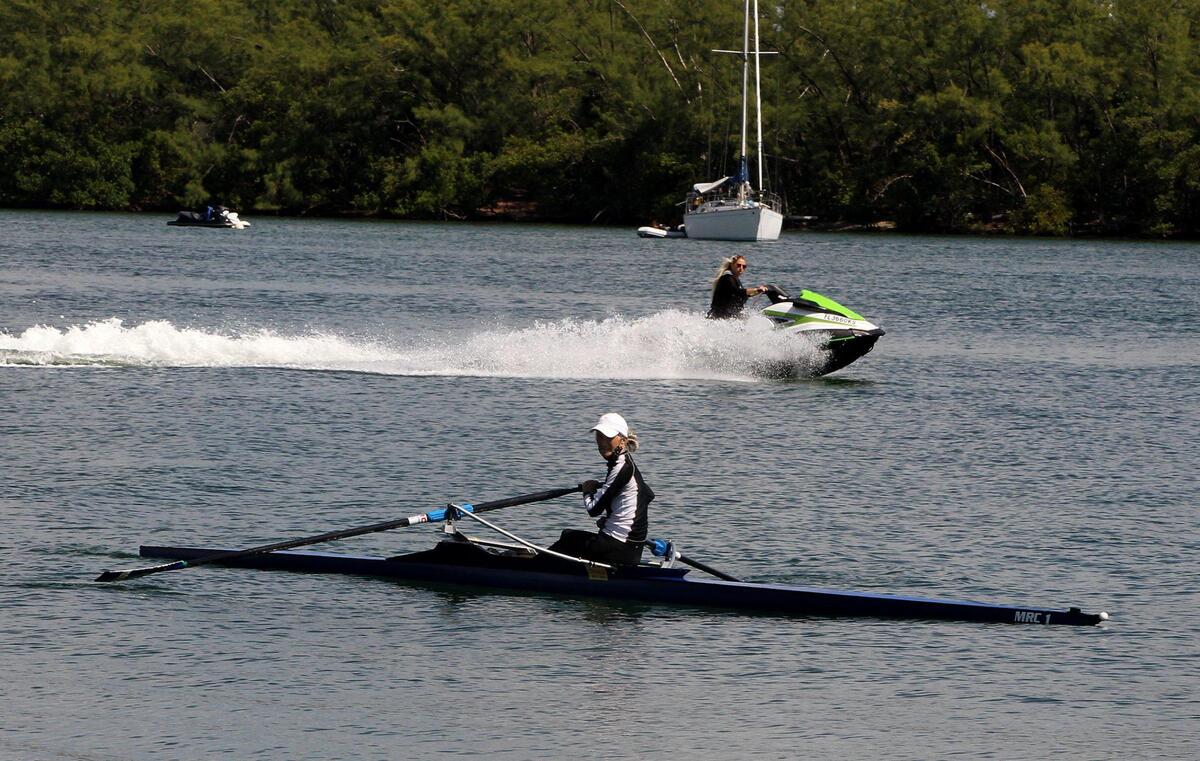 Rower Sue Kern slows down as a speeding watercraft passes in the Miami Marine Stadium basin on Virginia Key in 2020. Paddlers and rowers asked the city to help solve the bad boater problem with a mooring field in 2021.
