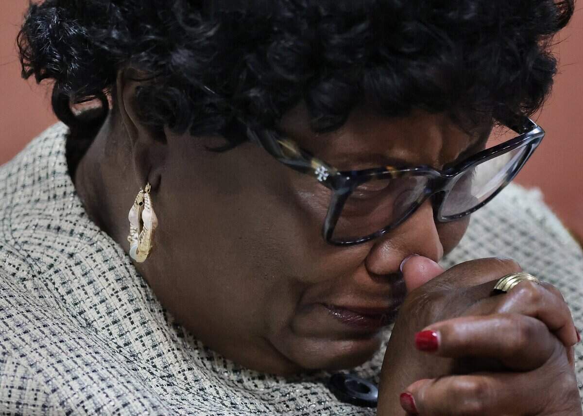 A Bethel Evangelical Baptist Church congregant weeps while praying as the congregation is coping with the burden left by the end of Temporary Protected Status, which has left tens of thousands of Haitians in South Florida in immigration limbo. Fearing for their safety, many have made the difficult decision to stay home on Sunday, September 13, 2026, in Miami Gardens, Fla.
