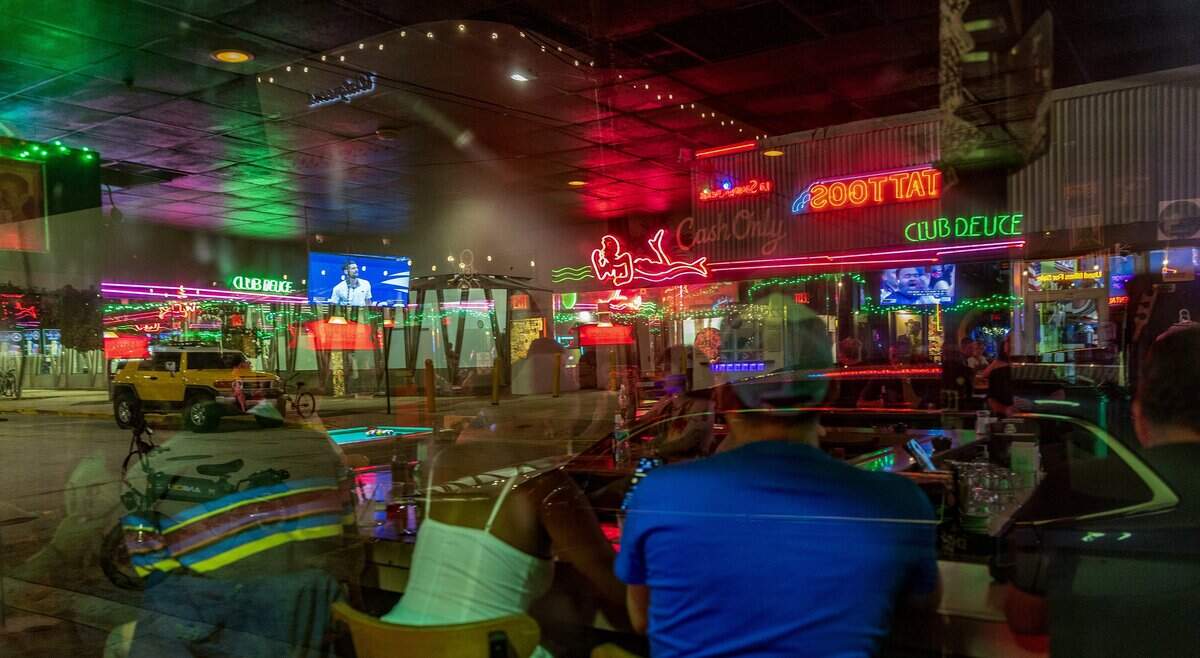Street view as patrons enjoy Mac's Club Deuce.