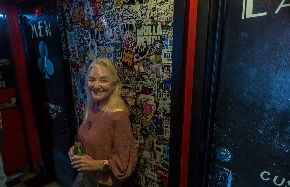 Former bartender Melissa Burley poses at Mac's Club Deuce.