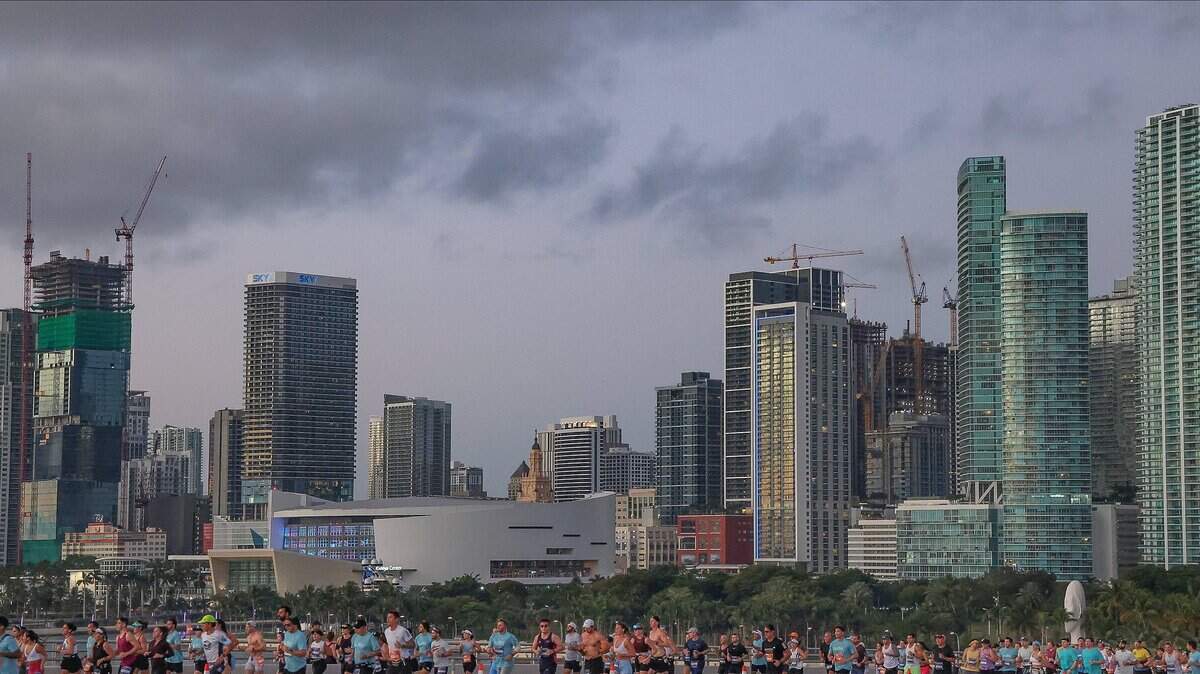Runners head eastbound on the MacArthur Causeway, against the partial skyline at the Life Time Miami Marathon & Half on Sunday, January 25, 2026, in Miami, Florida.