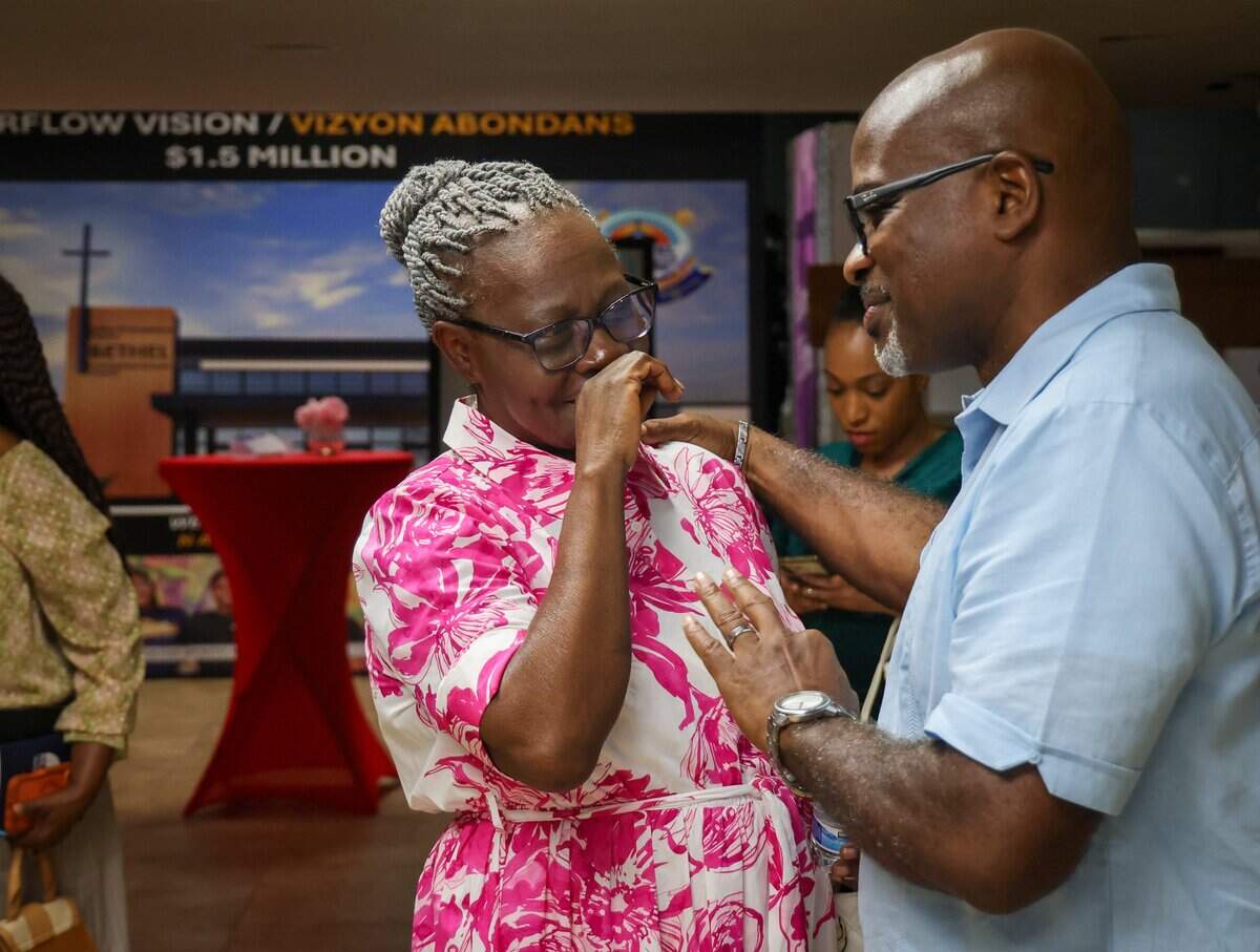 Pastor Keny Felix, right, offers words of faith and support to departing congregants at Bethel Evangelical Baptist Church in Miami Gardens, Fla., on Sunday, Sept. 13, 2026. Church attendance has declined by about 20% since Temporary Protected Status ended for more than 300,000 Haitians.