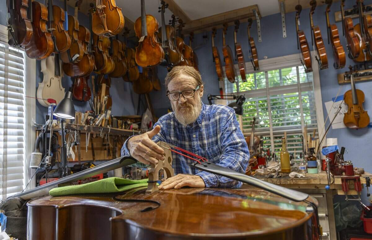 Miami String Haus luthier Dale Cockrum talks about an instrument he is working on inside the store's workshop on Thursday, Aug. 6, 2026, in El Portal, Fla. Miami String Haus is a home-based luthier shop where customers can buy, repair and maintain string instruments, including violins, violas, cellos and double basses.