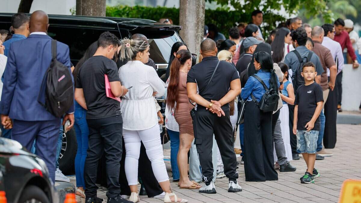 Immigrants arrive and wait in line as they wait for appointments outside of Miami Immigration Court in downtown Miami on Wednesday, September 9, 2026.