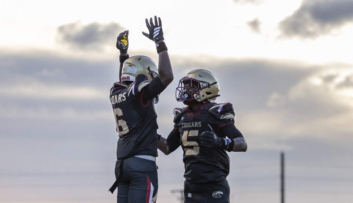 Coconut Creek Cougars wide receiver Everett Butler (6) celebrates after scoring a touchdown against the True North Classical Academy Titans in the first half of their Broward Football Showcase game at Coconut Creek High School on Friday, Aug. 28, 2026, in Coconut Creek, Fla.