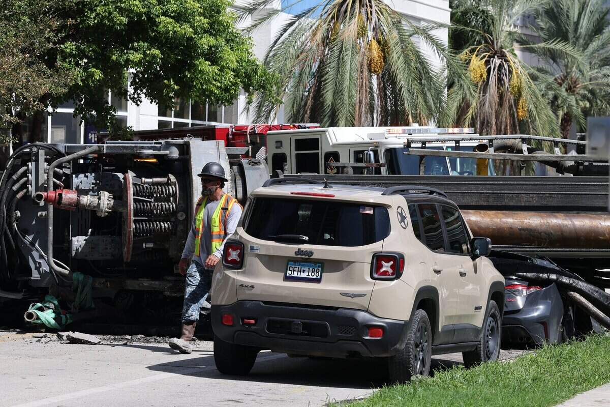 Construction equipment fell onto several cars on Brickell Bay Drive on Monday morning.