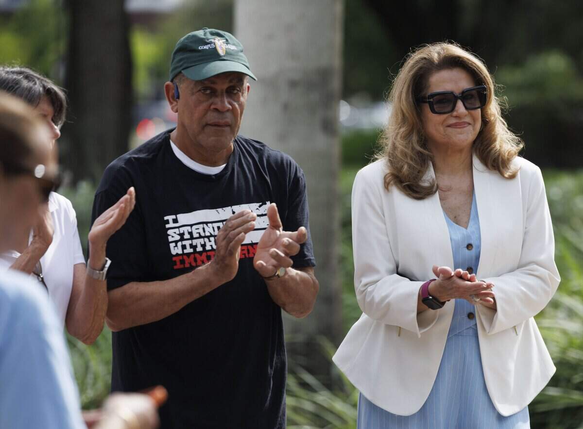 Former State Senator and CFO candidate Annette Taddeo, right, claps during a gathering outside of Doral City Hall on Tuesday, Sept. 22, 2026, in Doral, Fla. Speakers asked Doral City Council to rescind the city's 287(g) agreement with U.S. Immigration and Customs Enforcement (ICE).