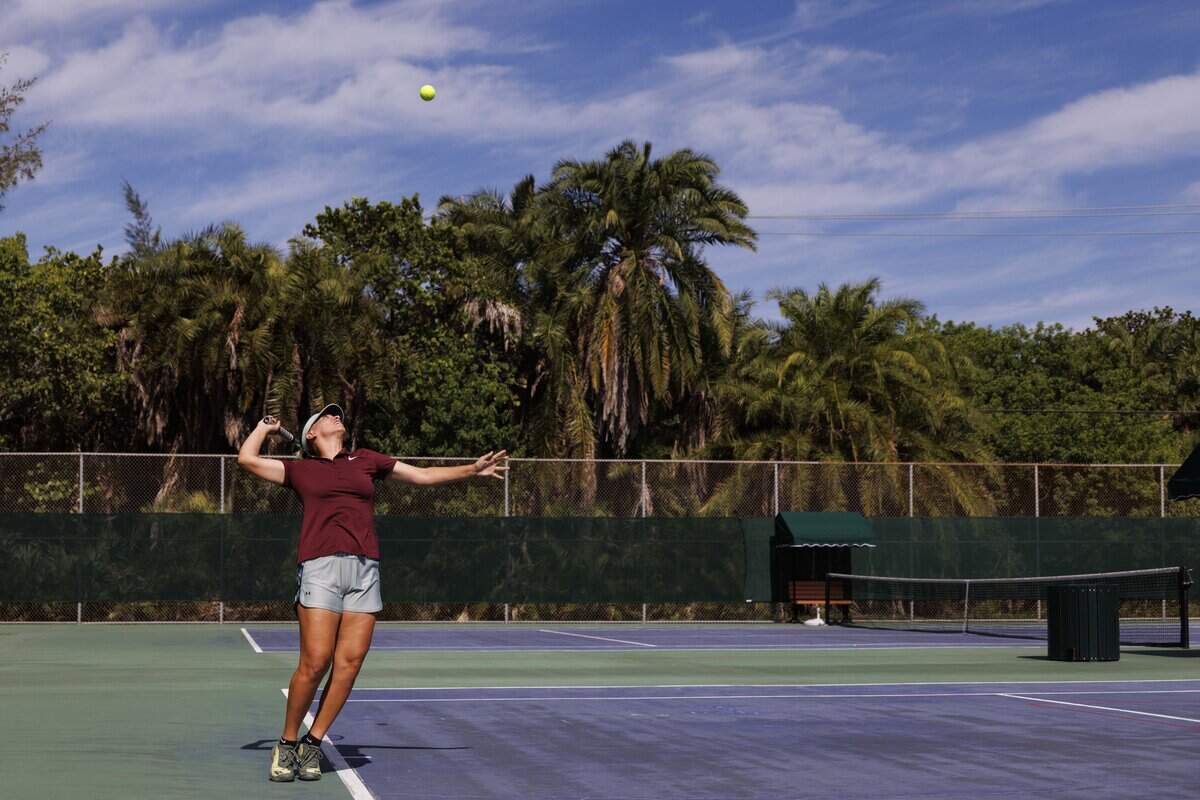 Claudia Carreras, Cuban tennis player who immigrated to the U.S. in 2022, volleys with her coach on Tuesday, July 21, 2026, at the Calusa Park tennis courts on Key Biscayne. Carreras founded “Turn on Tennis” in Miami.