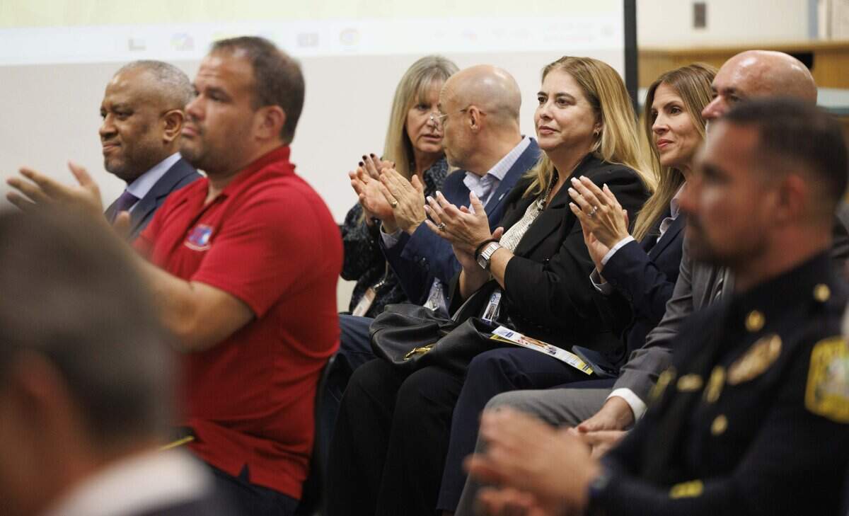 People clap during a press conference about renewing the Secure Our Future” referendum on Tuesday, Sept. 15, 2026, at JC Bermudez Doral Senior High School in Doral, Fla.