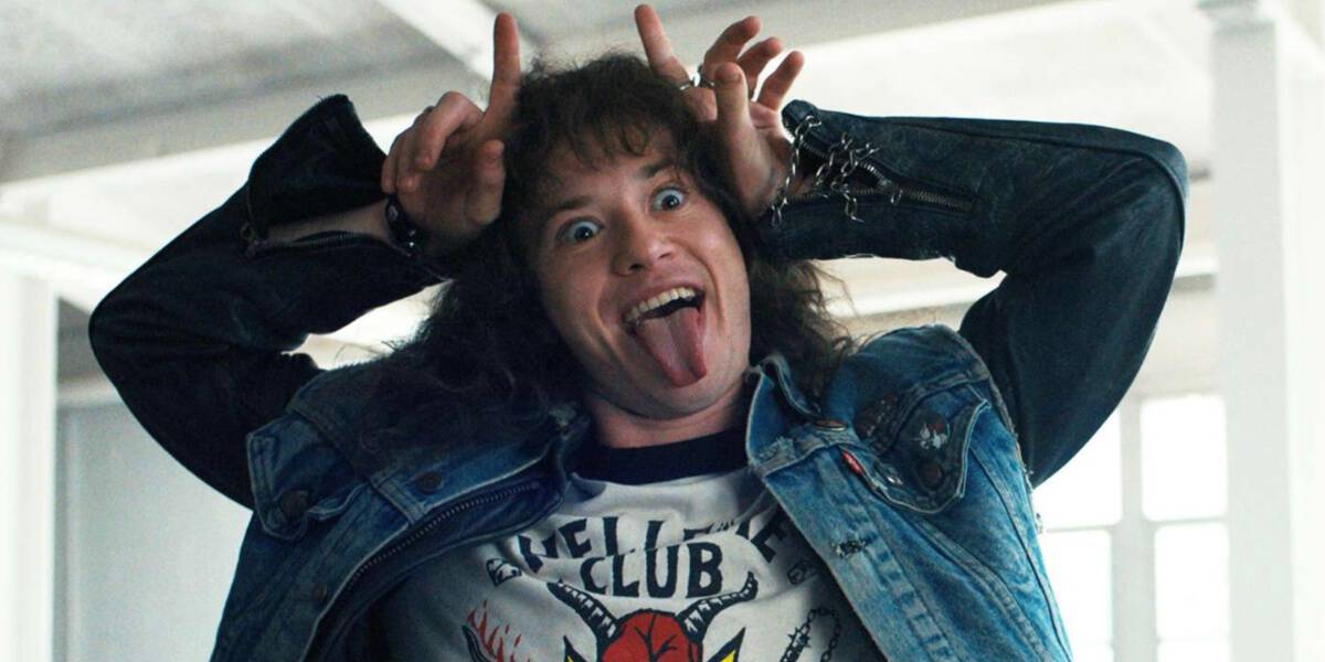 Eddie Munson (Joseph Quinn) making devil horns in 'Stranger Things'. Stranger Things 5 Halloween Horror Nights